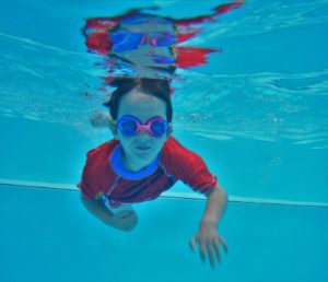 Aqua Stars child looking under water